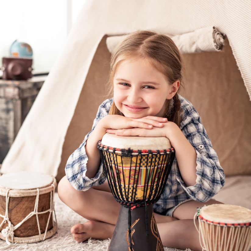 girl playing drums at Rogers School of Music